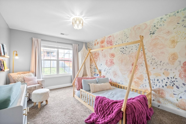 carpeted bedroom featuring baseboards, visible vents, and wallpapered walls
