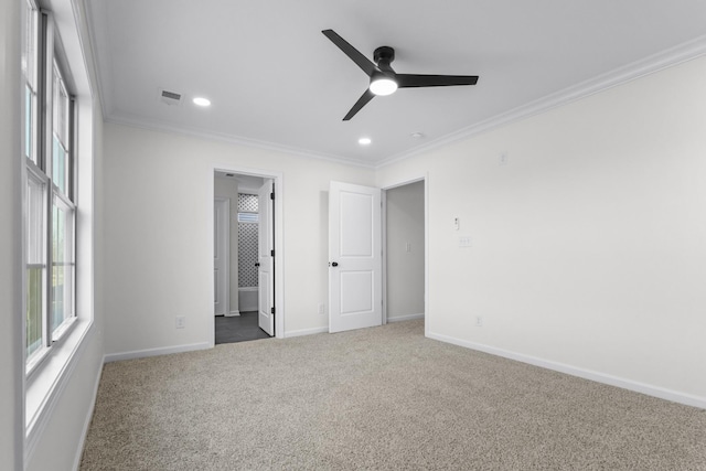 unfurnished bedroom with carpet floors, recessed lighting, baseboards, visible vents, and ornamental molding