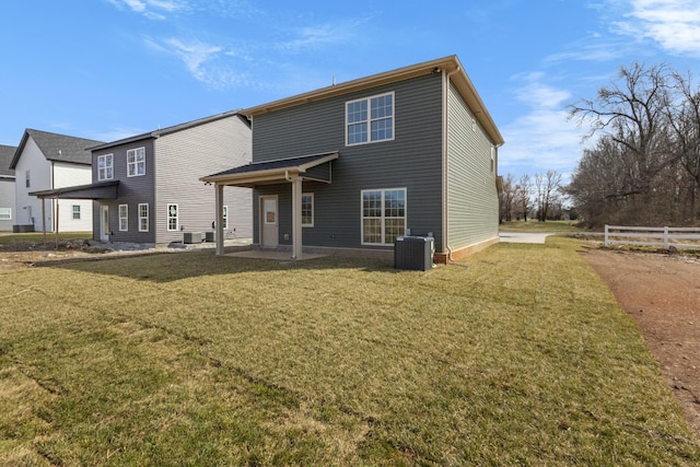 back of house with fence, a yard, central AC, and a patio area
