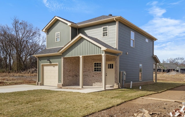 back of property featuring a lawn, an attached garage, driveway, and brick siding