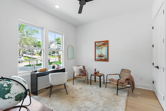 interior space with baseboards, recessed lighting, light wood finished floors, and ceiling fan