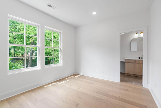 unfurnished bedroom with recessed lighting, baseboards, visible vents, and light wood finished floors