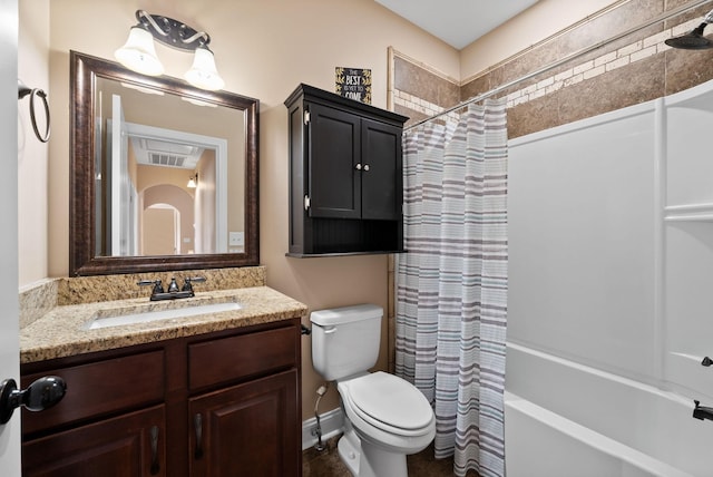 bathroom featuring vanity, shower / bath combo, toilet, and visible vents