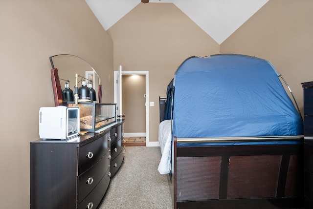 bedroom featuring carpet floors, baseboards, and lofted ceiling