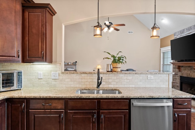 kitchen with visible vents, a ceiling fan, tasteful backsplash, a sink, and dishwasher
