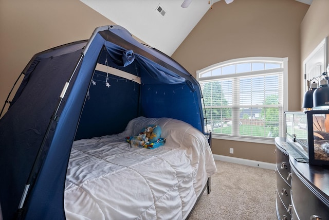 bedroom with ceiling fan, visible vents, baseboards, lofted ceiling, and carpet