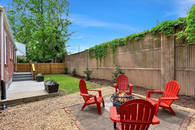 view of patio / terrace featuring a fenced backyard and an outdoor fire pit