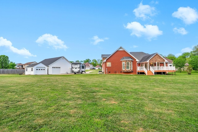 rear view of property featuring fence, stairs, brick siding, a wooden deck, and a lawn