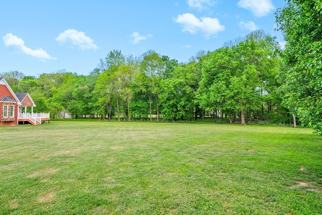 view of yard with a wooden deck