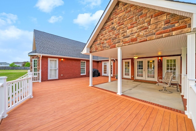 deck with ceiling fan, french doors, and a patio area