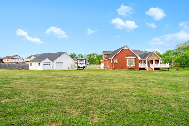 view of yard featuring fence and a wooden deck