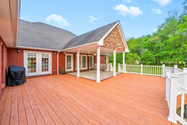 wooden terrace featuring french doors and grilling area