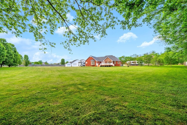 view of yard with a wooden deck