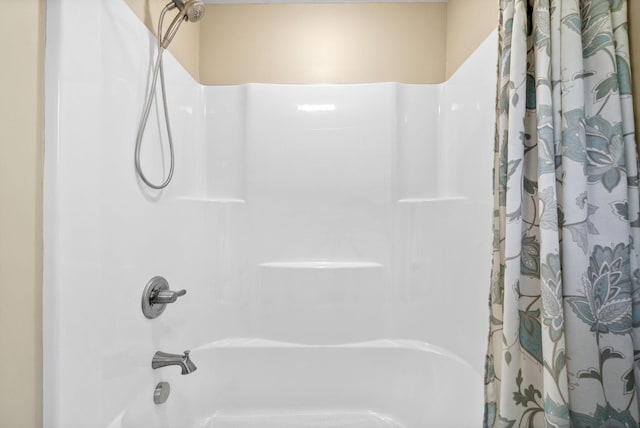 bathroom featuring shower / bathtub combination with curtain