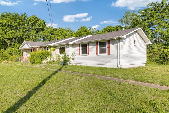 ranch-style home with a front lawn