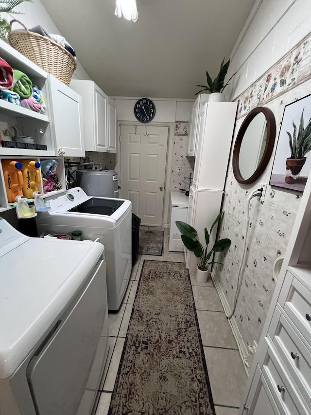 104 Brown Ln, Tracy City, TN 37387 - clothes washing area featuring separate washer and dryer, cabinet space, and light tile patterned floors