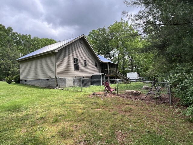 104 Brown Ln, Tracy City, TN 37387 - view of side of property with an outdoor fire pit, crawl space, and metal roof