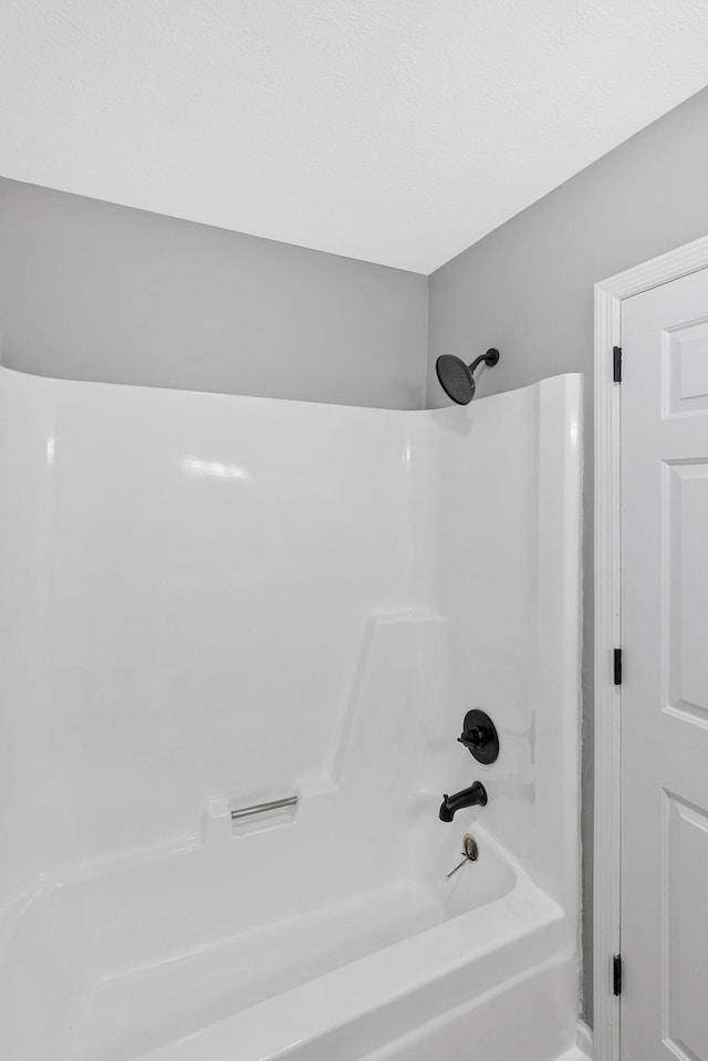 full bathroom with washtub / shower combination