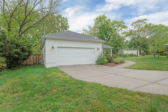 exterior space featuring fence, a shingled roof, a garage, a yard, and driveway
