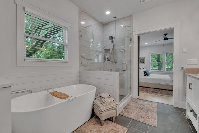 bathroom featuring a freestanding bath, a ceiling fan, recessed lighting, ensuite bathroom, and a stall shower