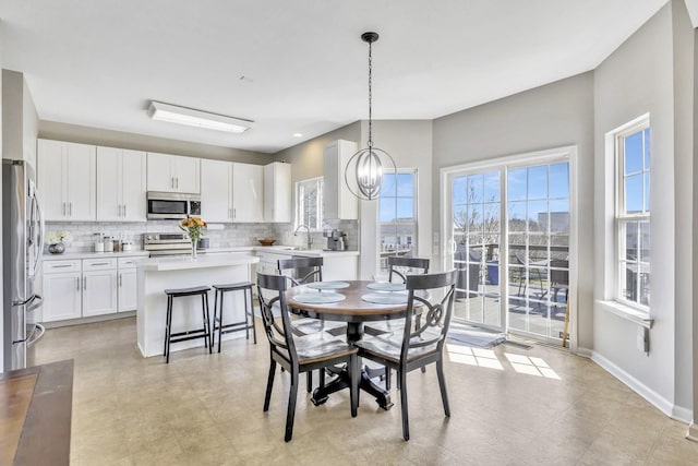 dining space with baseboards