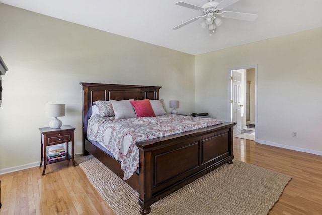 bedroom featuring baseboards, light wood-style floors, and ceiling fan
