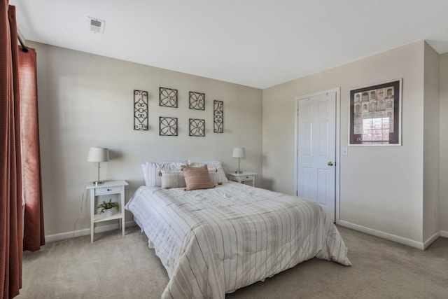 bedroom featuring baseboards, visible vents, and light colored carpet