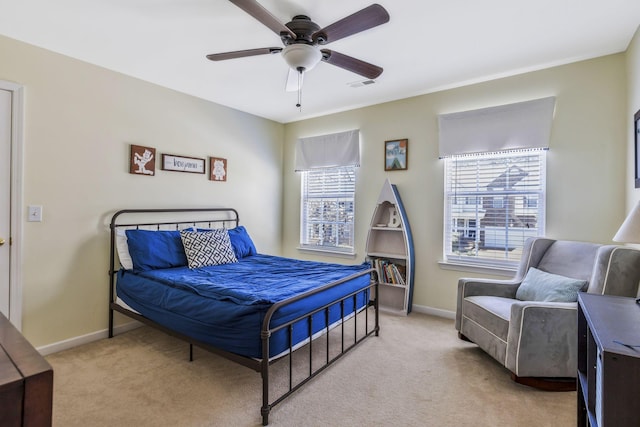 bedroom featuring light colored carpet, baseboards, and visible vents