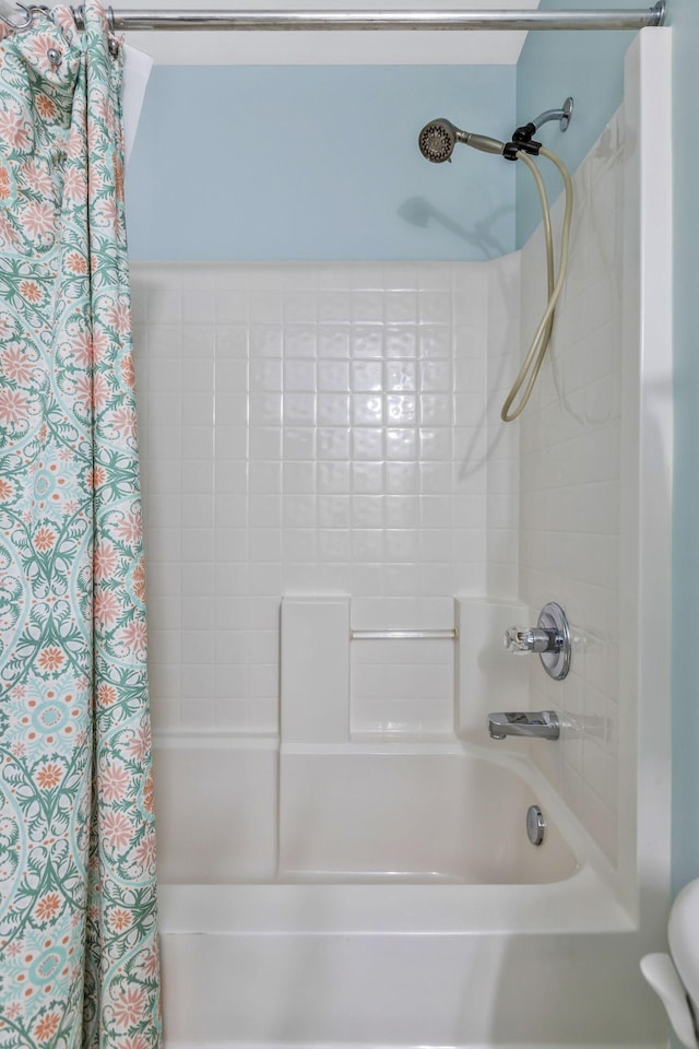 full bathroom featuring shower / bath combination with curtain