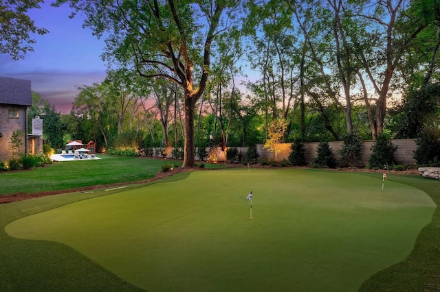 surrounding community featuring a lawn and fence