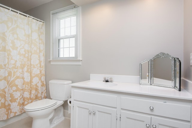 full bathroom featuring vanity, toilet, tile patterned floors, baseboards, and curtained shower