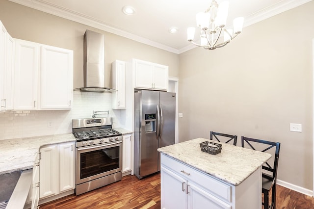 108 High St, Portland, TN 37148 - kitchen with appliances with stainless steel finishes, wall chimney range hood, a chandelier, dark wood finished floors, and tasteful backsplash