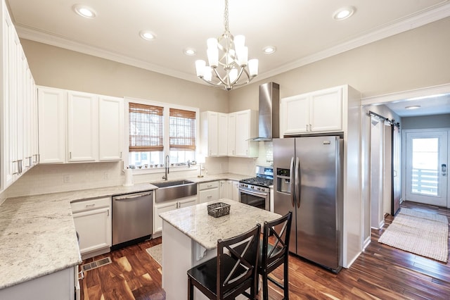 108 High St, Portland, TN 37148 - kitchen with stainless steel appliances, a sink, wall chimney exhaust hood, a chandelier, and dark wood-style floors