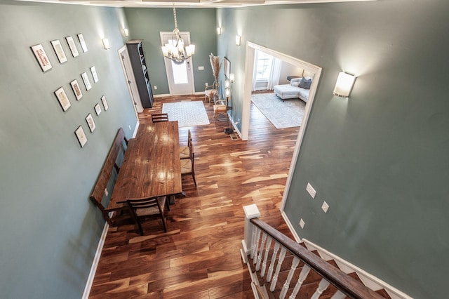 108 High St, Portland, TN 37148 - hallway featuring dark wood-style floors, a chandelier, and baseboards
