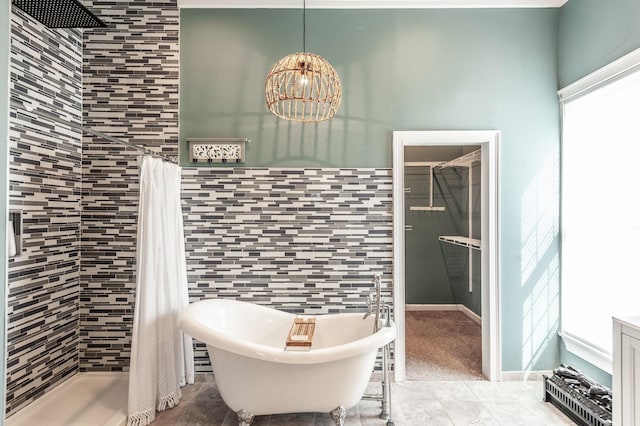 108 High St, Portland, TN 37148 - bathroom with a tile shower, a soaking tub, and a chandelier