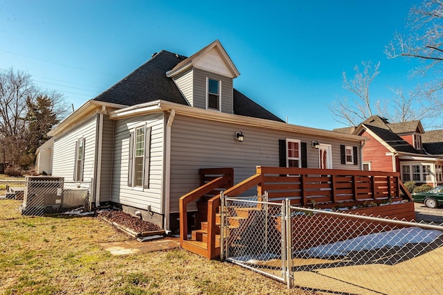 108 High St, Portland, TN 37148 - rear view of property featuring a gate and a shingled roof