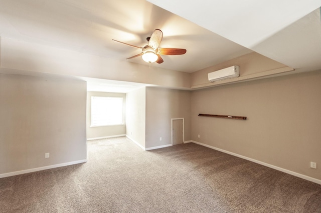 108 High St, Portland, TN 37148 - spare room with a wall unit AC, ceiling fan, carpet flooring, and baseboards