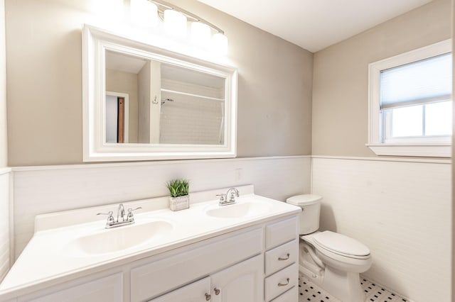 108 High St, Portland, TN 37148 - full bath featuring double vanity, wainscoting, toilet, a shower, and tile patterned floors