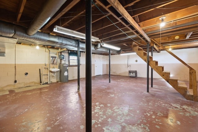 unfinished below grade area with water heater and stairs