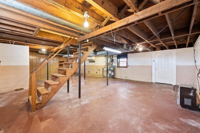 below grade area with stairs and water heater