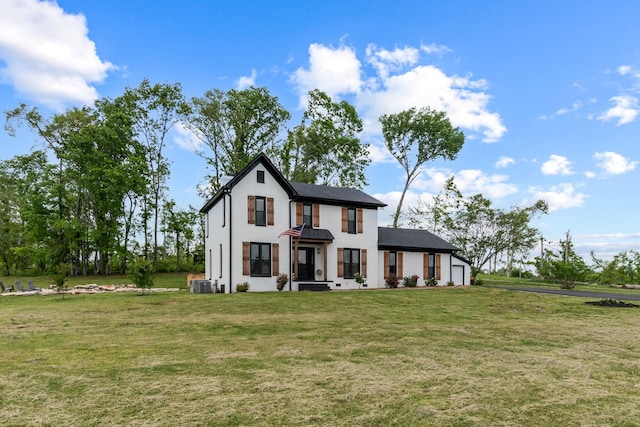 modern farmhouse featuring central AC unit and a front yard