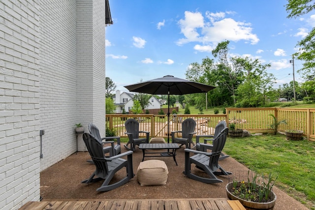 wooden deck with a lawn