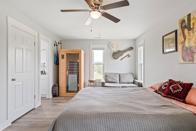 bedroom with a ceiling fan and light wood finished floors