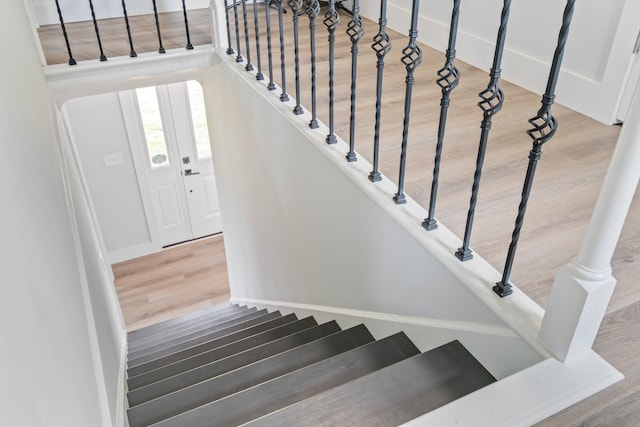 staircase featuring wood finished floors