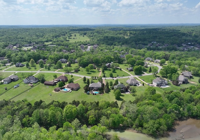 bird's eye view with a residential view and a wooded view