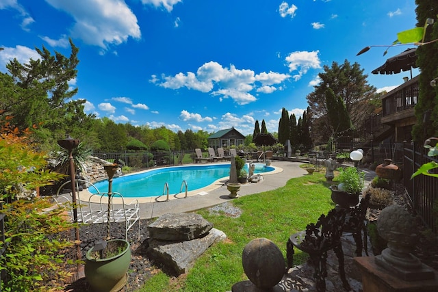 community pool featuring a patio area and fence