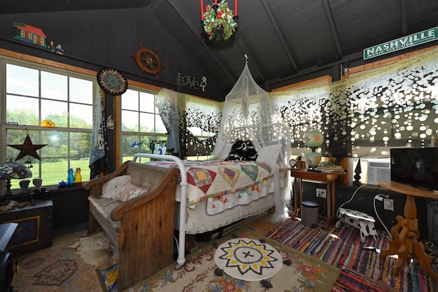 bedroom featuring vaulted ceiling and multiple windows