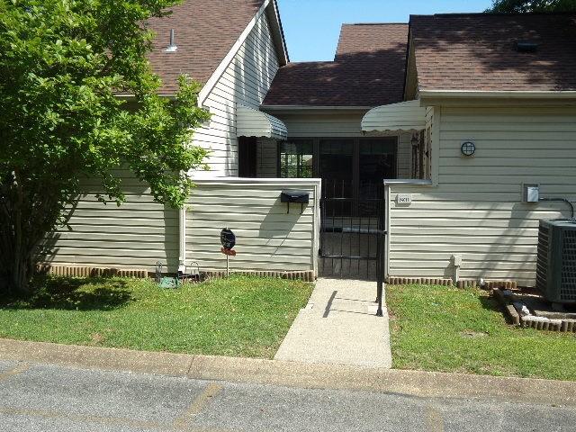 801 Laurel Hill Dr Unit 801, Old Hickory, TN 37138 - view of side of home with central air condition unit, a fenced front yard, and a gate