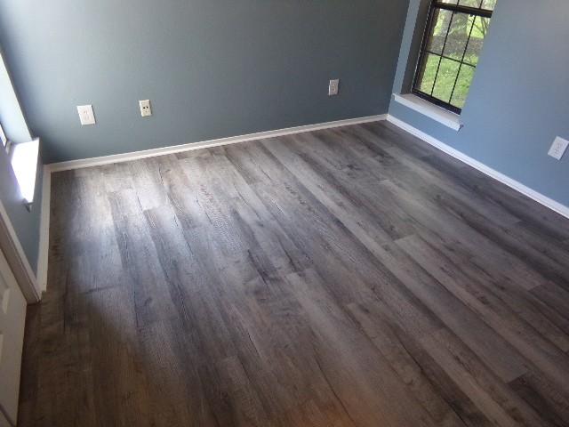 801 Laurel Hill Dr Unit 801, Old Hickory, TN 37138 - unfurnished room with baseboards and dark wood-type flooring