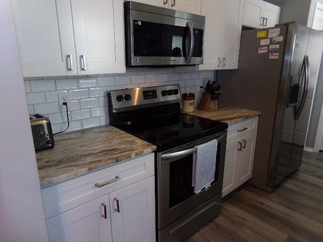 801 Laurel Hill Dr Unit 801, Old Hickory, TN 37138 - kitchen featuring white cabinets, dark wood-style flooring, light stone countertops, and appliances with stainless steel finishes